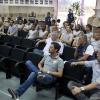 Elenco do Corinthians assistindo palestra de arbitragem
