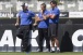 Sylvinho (ao centro) com Mano Menezes, ent�o treinador, e F�bio Carille, ent�o auxiliar como o...